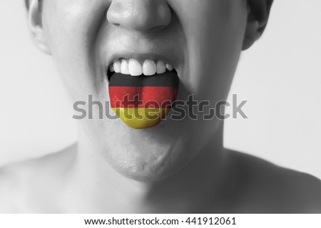 Germany flag painted in tongue of a man - indicating German language and speaking in Black and White