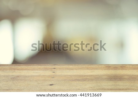 Wood table top on blurred abstract background - used for display or montage your products.