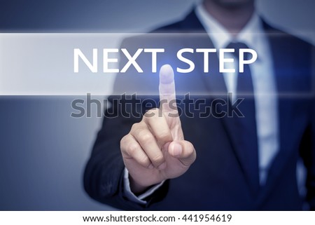 Businessman hand touching NEXT STEP button on virtual screen