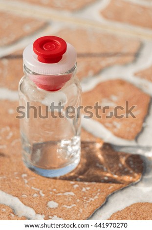 little bottle on the tiles