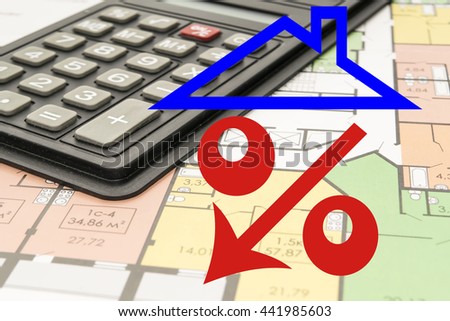 Red percent sign on the background of the calculator . The concept of reducing property prices