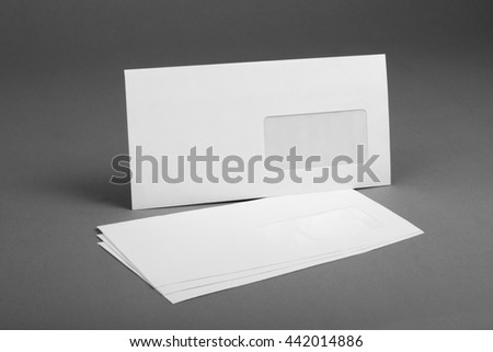 White envelope with address window on gray background