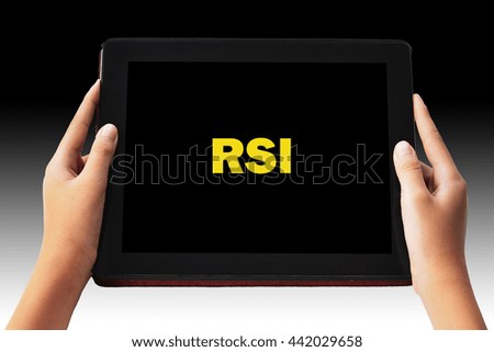 Financial Concept. Relative Strength Index " RSI" words in yellow  color on tabled in hands and black background.