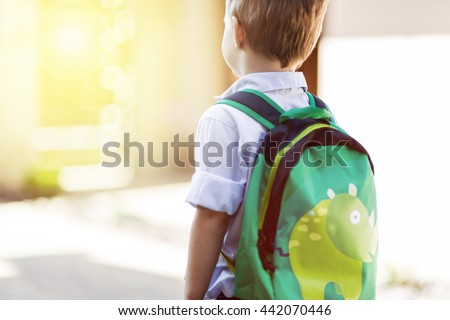 Child leaving home to his first day of kindergarten Royalty-Free Stock Photo #442070446