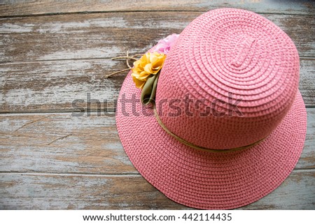 Beautiful pink hat with vintage wooden floor