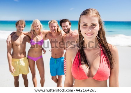 Portrait of friends posing at the beach on a sunny day