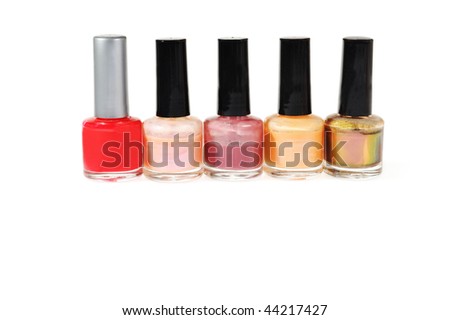 five colorful nail polish bottles in a row