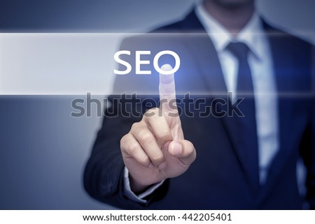 Businessman hand touching SEO button on virtual screen