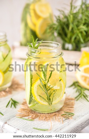 Cold Fruit Infused Detox Water with with lemon, cucumber and rosemary