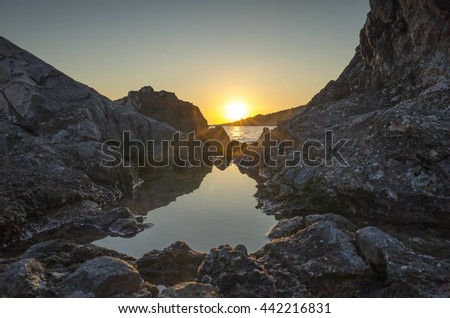 Croatia Europe Seascape. Nature and landscape photo. Reef, rock, stone, ocean and water. Calm and peaceful warm summer evening. Beautiful relaxing sunset,