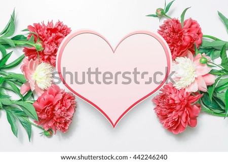Floral greeting card or frame for greeting text. Template for Valentine's Day card with pink and red flowers peonies. 