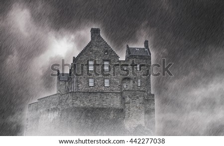 The big old stone Castle on the Rock during the heavy storm and rain - black and white picture