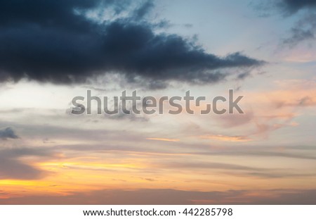 Dramatic sky with cloud storm and color of the sunset in twilight for design