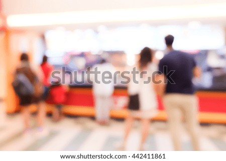 Blur image of people in restaurant.
