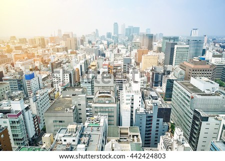 Business concept - panoramic modern city skyline bird eye aerial view with spiral tower and midland square under dramatic sunrise and morning blue sky on Nagoya TV Tower in Nagoya, Japan