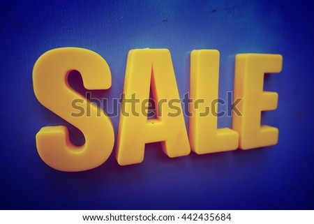 Sale concept. Yellow letters on blue background