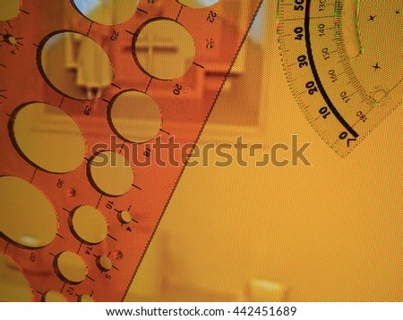 Yellow protractor and circle template on yellow screen background