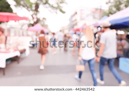 people walking street with bokeh, blurred background.