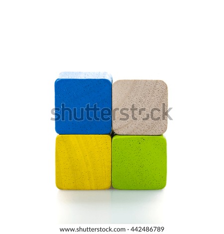 Wooden toy blocks on white background.