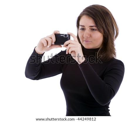 Woman with digital camera on the white background
