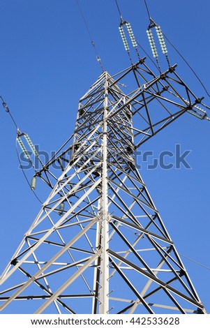   photographed close-up, high-voltage electric poles located in the   countryside
