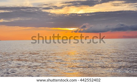 Scenic view of sunrise with colorful dramatic sky cloud above the sea in Khanh Hoa province. Early morning seascape, sunrise on the beach at the central coast of Vietnam. Nature background in panorama