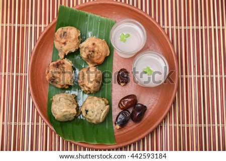 Sughiyan / Modhakam , stuffed green gram balls, popular evening Kerala snack sweet dish made with coconut,  jaggery .  traditional deep fried tea- time Indian mithai in mud plate