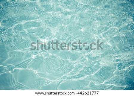 swimming pool with sunny reflections background