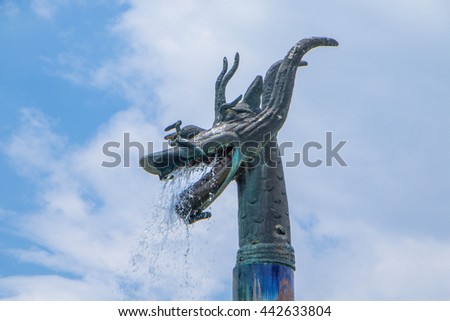 Soft focus Dragon sculpture with blue sky, head of a dragon on blue sky