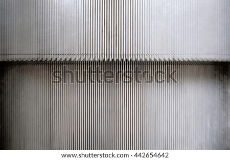 Motion blur of a running escalator.