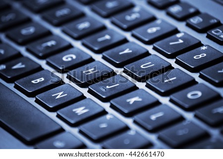 Close-up image of a laptop keyboard with shallow depth of field.