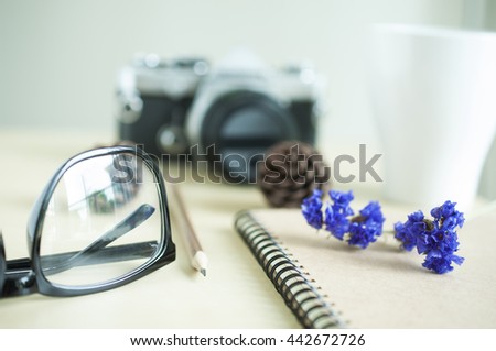 Selective focus small flower on blur workdesk background
