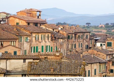 old roof of city buildings in Siena in Italy