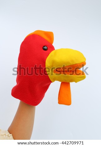 hand wearing children puppets, Chicken head