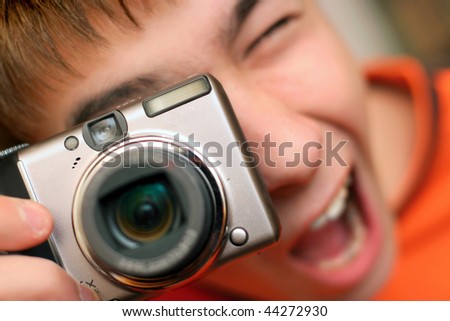 A young teenager gets ready to take a photograph
