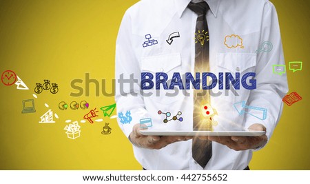 businessman holding a tablet computer with BRANDING text ,business analysis and strategy as concept