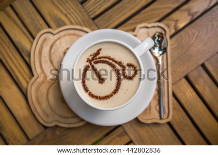 Cup of coffee with bicycle picture