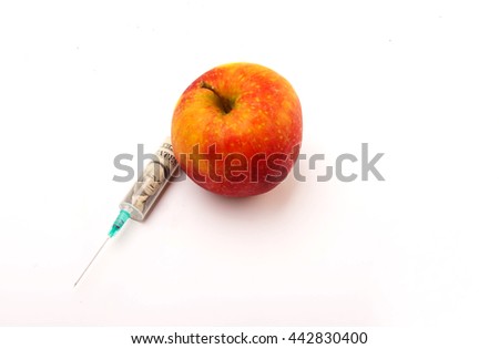 Injection and Apple on white background