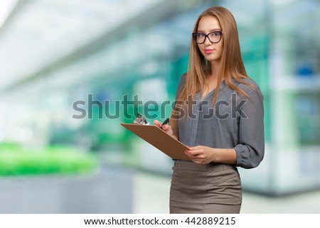 Happy smiling beautiful young woman with clipboard