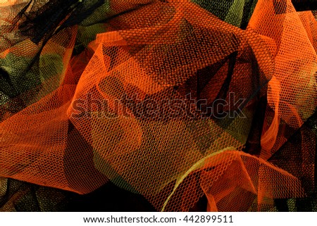 Colored backgrounds with tulle fabric textured wallpaper.