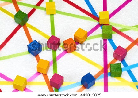 Colorful ribbons create a network on a white background.