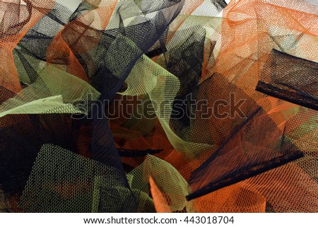 Colored backgrounds with tulle fabric textured wallpaper.