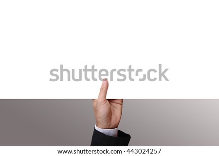 Businessman's hand holding from under of blank cardboard, white paper, poster, frame, advertisement card, or banner. Blank space for your text, design, or copy space.  