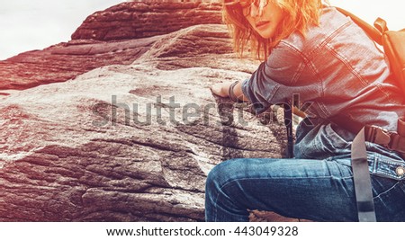 Asian woman enjoying the climbing natural stone,Vintage picture.