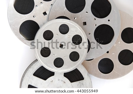 pile of film reels on a white background top view close up