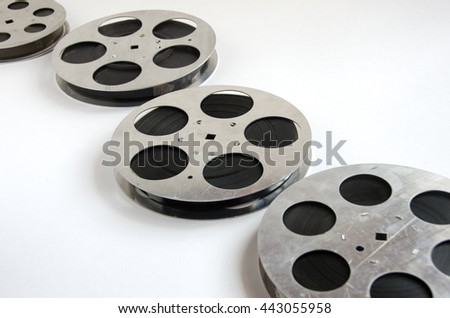 group of aluminum film reels on a white background