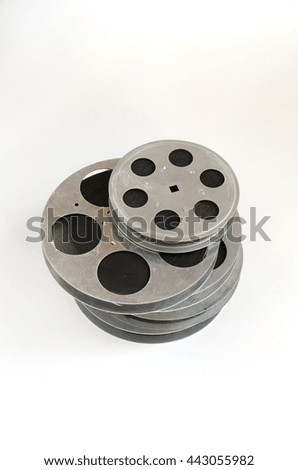 stack of old film reel on a white background