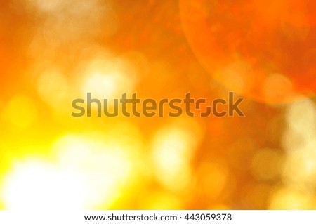 The glare of the sun, orange, yellow, the sun's rays, through th