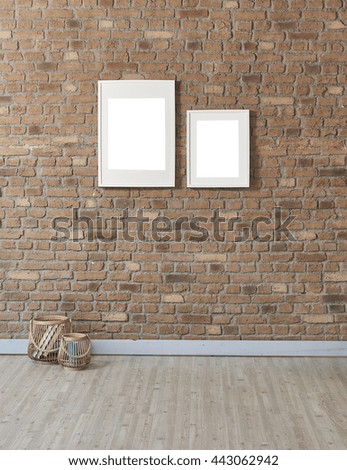 natural brick wall and white two frame with basket