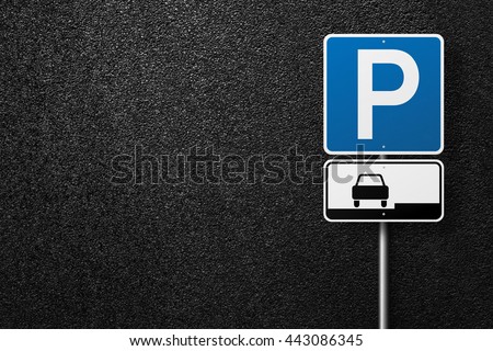 Road signs on a background of asphalt. Parking. The texture of the tarmac, top view.